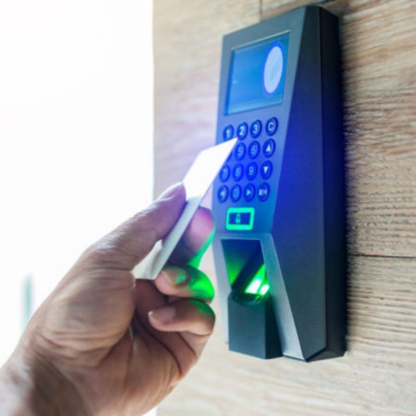 man tapping card on access control unit
